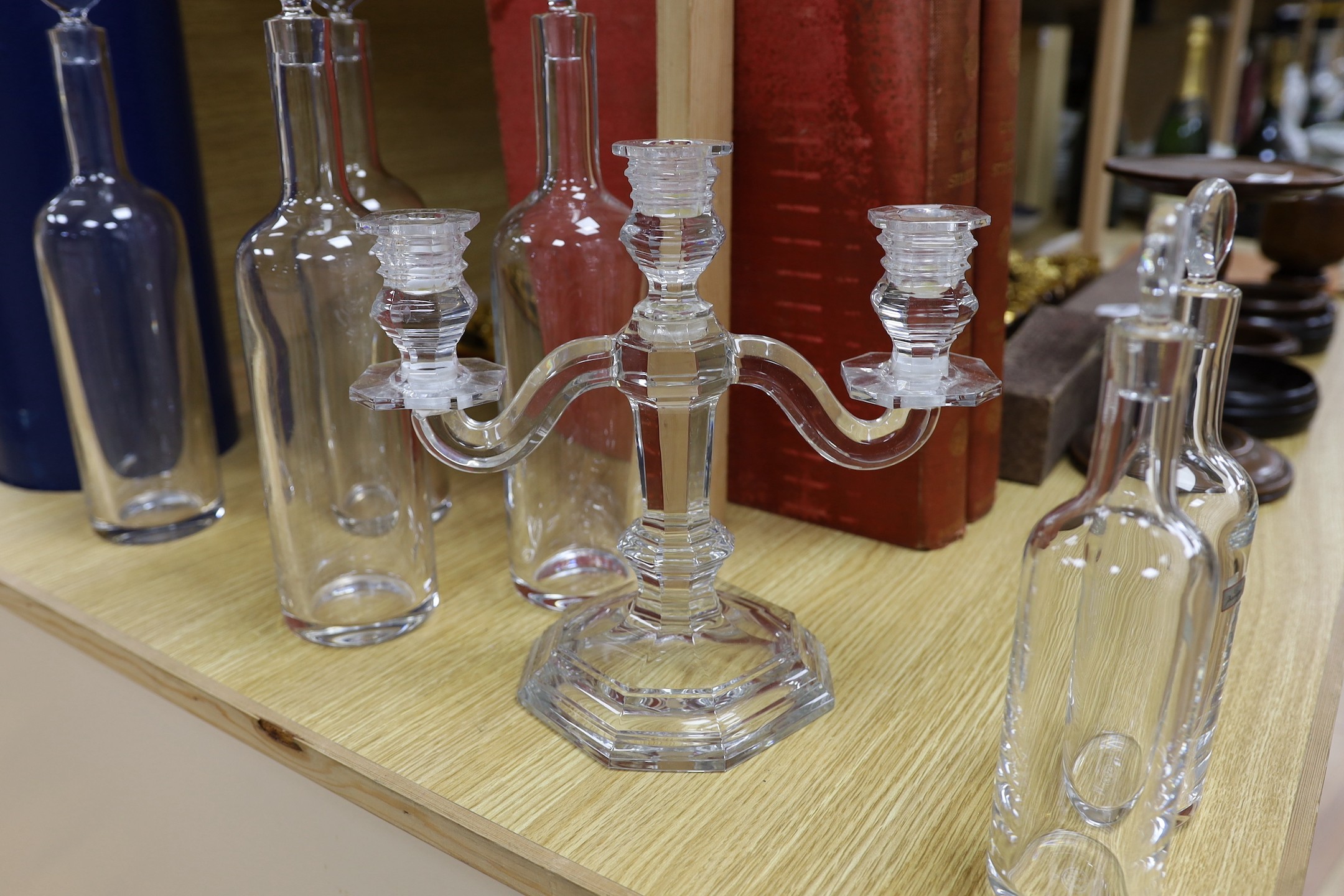 A Baccarat crystal three branch candelabrum, 25.5cm high and six Baccarat decanters and stoppers